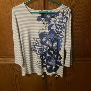 Blue and white striped shirt with floral print and nailhead decoration